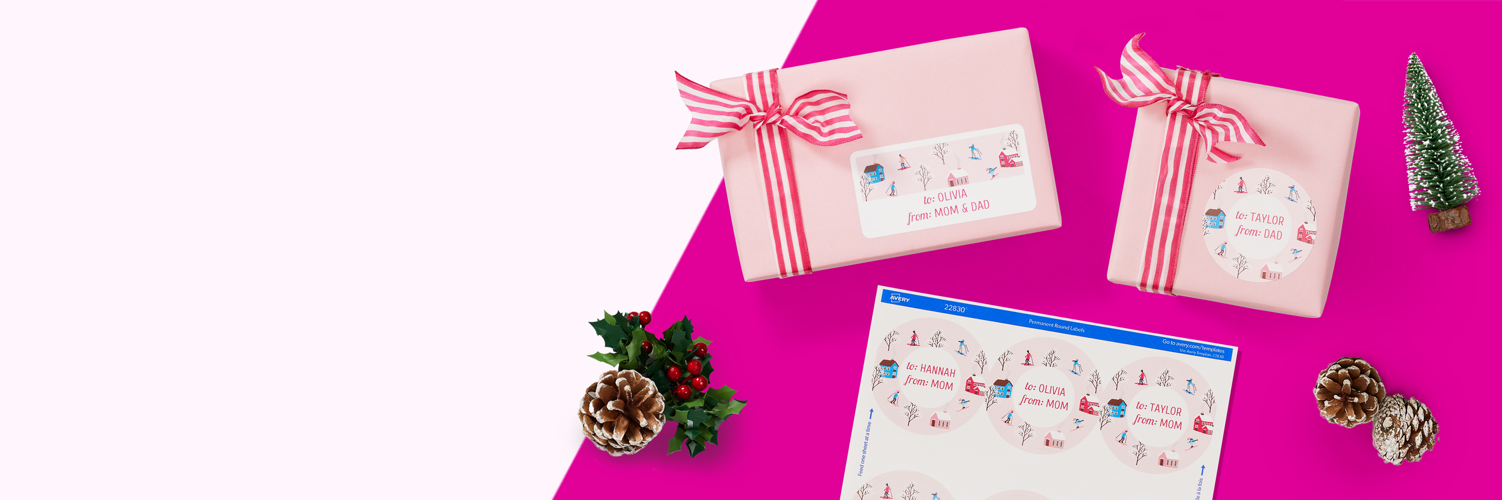 Motion graphic flatlay of two holiday gifts in pink wrapping paper tied with pink and white striped ribbons, one with a larger rectangle label on top and the other with a large round label on top, sitting next to a printed sheet of large round labels with a pink design. The gifts and labels are surrounded by a small faux holiday tree, snow-dusted pinecones, and holly.
